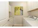 Laundry room featuring a washing machine, dryer, and ample storage space at 9789 Rue Renee Ln, McCordsville, IN 46055