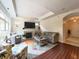 Spacious living room with hardwood floors, fireplace, and ample seating for entertaining at 9789 Rue Renee Ln, McCordsville, IN 46055