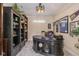 Well-lit office with custom built-ins and a unique ceiling fan at 9789 Rue Renee Ln, McCordsville, IN 46055