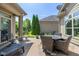 Backyard patio with outdoor seating and a view of landscaped yard at 9789 Rue Renee Ln, McCordsville, IN 46055