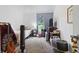 Cozy bedroom with natural light and personal touches, offering a comfortable and inviting space for relaxation at 1000 E Willard St, Muncie, IN 47302