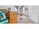 Bright bedroom with a window, cat tree, and a mix of boxes and personal items, ready for personalization at 1000 E Willard St, Muncie, IN 47302