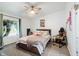 Comfortable bedroom featuring natural light, a cozy bed, and a ceiling fan, creating a relaxing retreat at 1000 E Willard St, Muncie, IN 47302