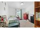Bright bedroom featuring a patterned bedspread, light-colored walls, and natural light from a window at 1000 E Willard St, Muncie, IN 47302