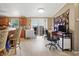 Open kitchen and dining area featuring wooden cabinetry, modern appliances, and a view of the workspace at 1000 E Willard St, Muncie, IN 47302