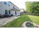 Backyard with fire pit and a paver patio at 10266 Hatherley Way, Fishers, IN 46037