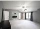 Bedroom features carpet, a ceiling fan, TV mount, and two windows with curtains at 10266 Hatherley Way, Fishers, IN 46037