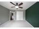 Bedroom with ceiling fan, carpeted floor, and walk-in closet is visible through the open door at 10266 Hatherley Way, Fishers, IN 46037
