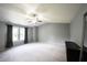Bedroom with vaulted ceilings, a ceiling fan, carpet, and a large window with curtains at 10266 Hatherley Way, Fishers, IN 46037
