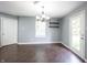 Cozy dining room featuring new light fixture, updated flooring, and exterior door at 10266 Hatherley Way, Fishers, IN 46037