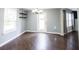 Cozy dining room featuring updated flooring, shelves, and a modern light fixture at 10266 Hatherley Way, Fishers, IN 46037