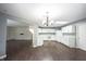 Bright kitchen with white cabinets, modern appliances, and wood-look flooring at 10266 Hatherley Way, Fishers, IN 46037