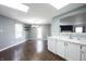 Bright kitchen with white cabinets, countertops, and access to dining area at 10266 Hatherley Way, Fishers, IN 46037