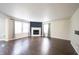 Spacious living room with a fireplace, neutral walls and multiple windows for natural light at 10266 Hatherley Way, Fishers, IN 46037