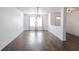 Spacious, bright living room featuring hardwood floors, modern lighting, and lots of natural light at 10266 Hatherley Way, Fishers, IN 46037