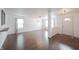 Open-concept living room with modern lighting and lots of natural light at 10266 Hatherley Way, Fishers, IN 46037
