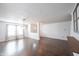 Open-concept living room featuring hardwood floors and lots of natural light at 10266 Hatherley Way, Fishers, IN 46037