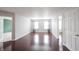 Open living room with bright windows, grey walls and hardwood floors at 10266 Hatherley Way, Fishers, IN 46037