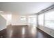 Living room featuring lots of natural light, neutral paint, and wood-look flooring at 10266 Hatherley Way, Fishers, IN 46037