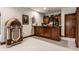 Basement bar and entertainment area featuring a jukebox and unique decor at 10554 Hyde Park, Carmel, IN 46032