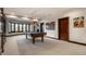 Finished basement featuring a billiards table and large bay window for natural light at 10554 Hyde Park, Carmel, IN 46032