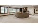The basement features a fireplace, seating, and large windows at 10554 Hyde Park, Carmel, IN 46032