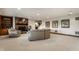 The basement features a fireplace, seating, and access to the rest of the house at 10554 Hyde Park, Carmel, IN 46032