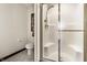 Modern bathroom showcasing a glass-enclosed shower with a built-in seat at 10554 Hyde Park, Carmel, IN 46032