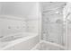 Elegant bathroom featuring a soaking tub and a separate glass shower at 10554 Hyde Park, Carmel, IN 46032