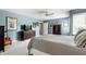 Bedroom featuring a large bed and walls adorned with artwork, creating a cozy and personalized living space at 10554 Hyde Park, Carmel, IN 46032