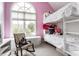 Bright bedroom featuring a large arched window and whimsical decor at 10554 Hyde Park, Carmel, IN 46032
