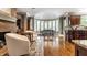 Open dining room with hardwood floors, lots of natural light, and an adjacent living area at 10554 Hyde Park, Carmel, IN 46032