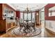 The formal dining room boasts a chandelier and hardwood floors at 10554 Hyde Park, Carmel, IN 46032
