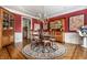 The formal dining room boasts a chandelier and hardwood floors at 10554 Hyde Park, Carmel, IN 46032