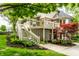 Charming two-story home with a deck, beautiful landscaping, and brick and siding accents at 10554 Hyde Park, Carmel, IN 46032