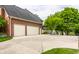 Spacious two-car garage with ample driveway parking and well-maintained brick exterior at 10554 Hyde Park, Carmel, IN 46032