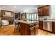 Spacious kitchen features a large island, stainless steel appliances, and granite countertops at 10554 Hyde Park, Carmel, IN 46032