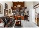 Cozy living room with built-in bookshelves and a comfortable leather sofa at 10554 Hyde Park, Carmel, IN 46032