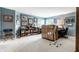 Spacious living room with an array of artwork, bookshelves and cabinetry, perfect for showcasing collectibles at 10554 Hyde Park, Carmel, IN 46032