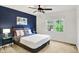 Bedroom with modern bed and blue accent wall at 10906 Camden Ct, Fishers, IN 46038