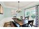 Bright dining room with a large wooden table, chandelier, and decorative wall art at 10906 Camden Ct, Fishers, IN 46038