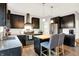 Modern kitchen with black cabinets, butcher block island, stainless steel appliances, and granite countertops at 10906 Camden Ct, Fishers, IN 46038