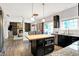 Open kitchen boasts butcher block island, stainless steel appliances, and seamless flow to the living room at 10906 Camden Ct, Fishers, IN 46038