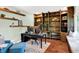 Comfortable office with custom shelving, a plush chair, and ample workspace for productivity at 10906 Camden Ct, Fishers, IN 46038