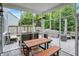Enclosed outdoor patio with picnic table and a view of the grilling and entertainment area at 10906 Camden Ct, Fishers, IN 46038