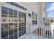 Townhome balcony featuring sliding glass doors and white railings at 1111 Cavendish Dr, Carmel, IN 46032