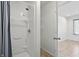 Compact full bathroom with shower stall and nearby linen closet, leading to a bonus room at 1111 Cavendish Dr, Carmel, IN 46032