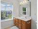 Well-lit bathroom featuring a double sink vanity, natural light, and ample counter space for a luxurious feel at 1111 Cavendish Dr, Carmel, IN 46032