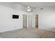 Bedroom with ceiling fan, TV, bathroom, and walk-in closet at 1111 Cavendish Dr, Carmel, IN 46032