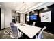 Modern conference room equipped with a large table, sleek chairs, and a mounted TV at 1111 Cavendish Dr, Carmel, IN 46032